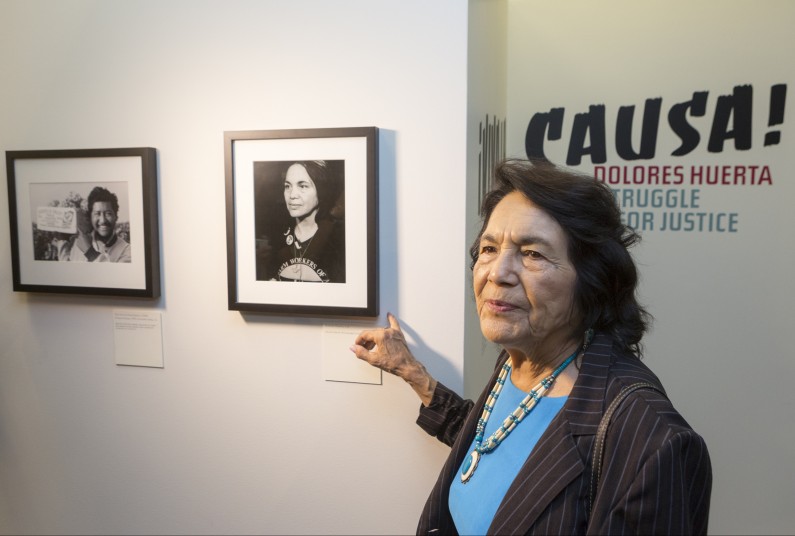 Dolores Huerta, co-founder of United Farms Workers (UFW) tours her exhibition, "Viva la Causa! Dolores Huerta and the Struggle for Justice," at La Plaza de la Cultura y Artes museum downtown Los Angeles on Thursday, April 10, 2014. The exhibit examines the role Huerta played in the fight for the rights of farm workers, and in the founding of the UFW with Cesar Chavez. The show will be on view thru July 7. (AP Photo/Damian Dovarganes)