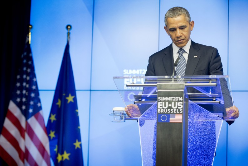 President Barack Obama pauses during a joint news conference with EU Council President Herman Van Rompuy and EU Commission President Jose Manuel Barroso at the EU-US summit meeting, Wednesday, March 26, 2014, at the EU Council building in Brussels, Belgium. Obama is on a one day trip to Belgium to shore up commitments he received from allies in The Hague, Netherlands, to reassure Eastern Europeans members of NATO that the alliance will stand by them and to make a larger point about European security a quarter-century after the fall of the Iron Curtain.(AP Photo/Pablo Martinez Monsivais)
