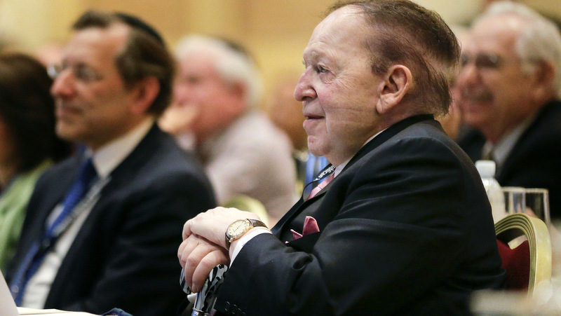 Sheldon Adelson listens as New Jersey Gov. Chris Christie speaks during the Republican Jewish Coalition, Saturday, March 29, 2014, in Las Vegas. Several possible GOP presidential candidates gathered in Las Vegas as Adelson, a billionaire casino magnate, looks for a new favorite to help on the 2016 race for the White House. (AP/Julie Jacobson)