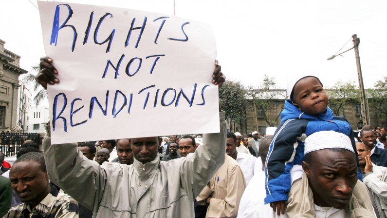 A Kenyan Muslim holds up a sign during protest against terrorism-related extraordinary renditions in Nairobi, Kenya, Friday, Sept. 14., 2007. A groundbreaking research project has mapped the U.S. government's global kidnap and secret detention programme, shedding unprecedented light on one of the most controversial secret operations of recent years. (AP Photo/Khalil Senosi)