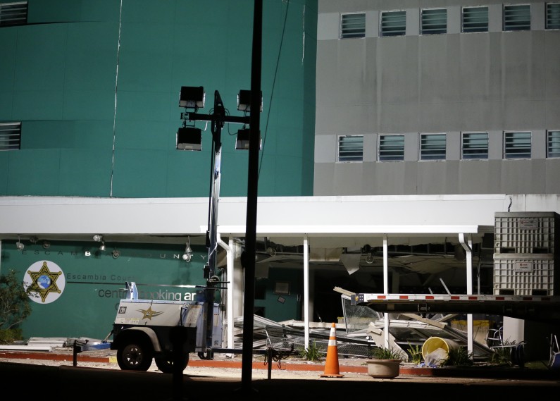 Damage to the Escambia County Jail is seen after an explosion in the facility Thursday, May 1, 2014, in Pensacola, Fla. Two inmates were killed and more than 100 others were injured in the explosion according to an Escambia County spokeswoman. (AP Photo/John Raoux)