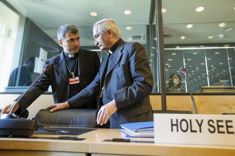 Archbishop Silvano M. Tomasi, right, Apostolic Nuncio, Permanent Observer of the Holy See (Vatican) to the Office of the United Nations in Geneva, speaks with Monsignor Christophe El-Kassis, left, prior the UN torture committee hearing on the Vatican, at the headquarters of the office of the High Commissioner for Human Rights (OHCHR) in the Palais Wilson, in Geneva, Switzerland, Monday, May 5, 2014. The UN Committee Against Torture hears the Holy See for the first time to consider whether the church's handling of child sexual abuse complaints has violated its obligations against subjecting minors to torture and to hear the Vatican on its efforts to stamp out child sex abuse by priests. (AP Photo/Keystone, Salvatore Di Nolfi)