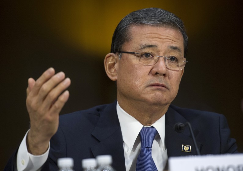 FILE - This May 15, 2014 file photo shows Veterans Affairs Secretary Eric Shinseki testifying on Capitol Hill in Washington. The Department of Veterans Affairs says it will allow more veterans to obtain health care at private hospitals and clinics. Shinseki announced the change Saturday. (AP Photo/Cliff Owen, File)