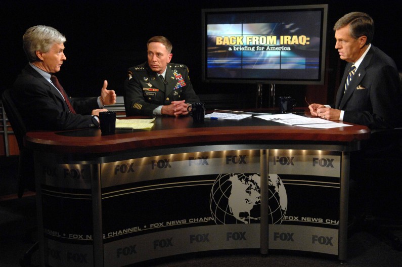 Ambassador Ryan Crocker, left, and Gen. David Petraeus, center, take part in an interview with Brit Hume on FOX News on Monday, Sept. 10, 2007 in Washington.  (AP Photo/Kevin Wolf)