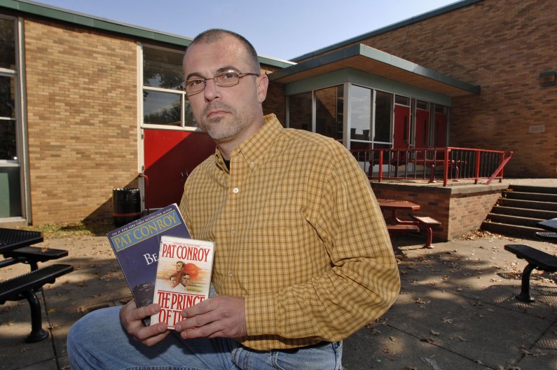 Steve Shamblin an English teacher at Nitro High School, holds banned books by author Pat Conroy Thursday, Nov. 1, 2007 in Nitro, W.Va. The Pat Conroy books "Beach Music" and "The Prince of Tides" were suspended from Nitro High School English classes after parents of two students complained about depictions of violence, suicide and sexual assault. (AP Photo/Jeff Gentner)