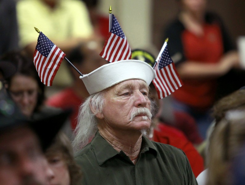 Vietnam veteran Louis Albin, who served in the U.S. Navy, listens during a town hall meeting at American Legion Post 1 on Monday, June 9, 2014, in Phoenix concerning health-care issues at the Phoenix VA facilities. One Veterans Affairs Department health care system in Arizona has been flagged for further review following a nationwide audit of the agency's troubled appointment process, according to a report released Monday. (AP Photo/Ralph Freso)