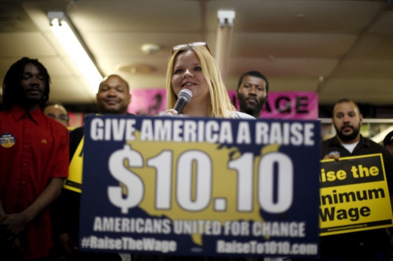 In this photo made Friday, April 25, 2014, Amy Jennewein speaks during a rally in support of raising the minimum wage University City, Mo. Jennewein, who lives in the outer St. Louis suburb of House Springs, earns a little above Missouris $7.50 minimum wage at one of her jobs and nearly $11 an hour at the other. (AP Photo/Jeff Roberson)