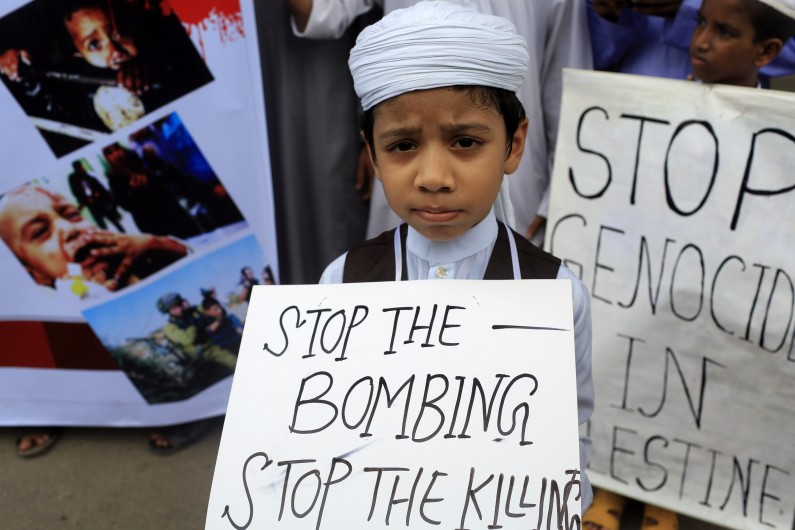 A Bangladeshi child protests against Israeli attack on Gaza in Dhaka, Bangladesh, Saturday, July 12, 2014. (AP Photo/A.M. Ahad)