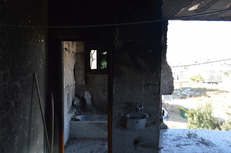 The former bathroom and living room of Amer Abu Aisha, one of the two prime suspects in Operation Brother's Keeper. Israel detonated a bomb destroying the home where he lived with his wife and two children. (Photo by Sheren Khalel for MintPress News)