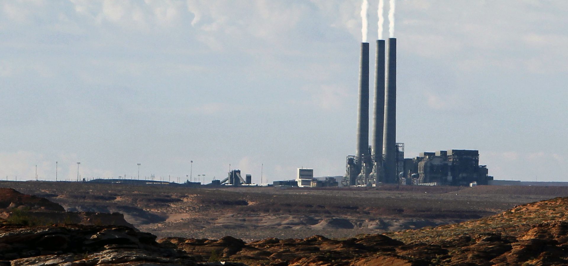 A coal-burning facility at the Navajo Generating Station, as seen from Lake Powell in Page, Ariz. (AP Photo/Ross D. Franklin, File)