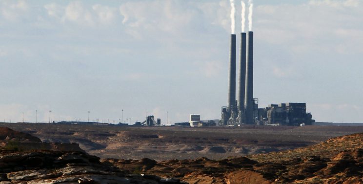 A coal-burning facility at the Navajo Generating Station, as seen from Lake Powell in Page, Ariz. (AP Photo/Ross D. Franklin, File)