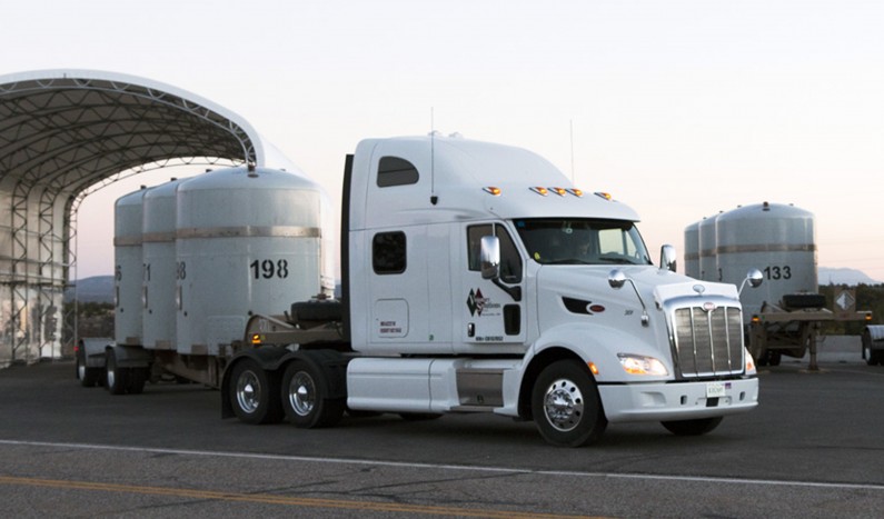 In this photo taken on Tuesday, April 1, 2014, and provided by the Los Alamos National Laboratory, a truck hauls a shipment of nuclear waste from Los Alamos National Laboratory in Los Alamos, N.M. Los Alamos National Laboratory, which is under a tight deadline to get nuclear waste off its northern New Mexico campus before wildfire season peaks, has begun trucking the remainder of the waste to Texas. (AP Photo/Los Alamos National Laboratory)