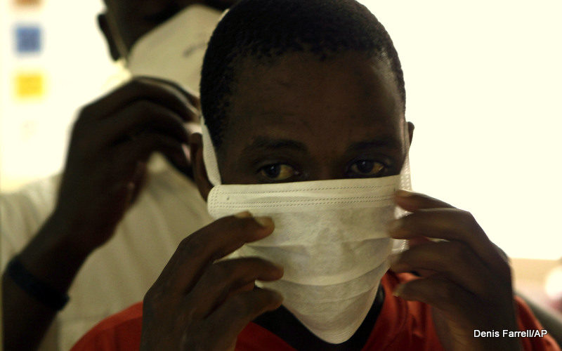 An unidentified patient prepares to be tested for TB, at a clinic in Johannesburg, South Africa.