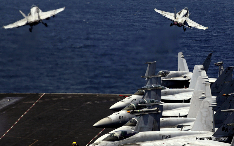 U.S. F/A-18 fighter jets take off for mission in Iraq from the flight deck of the U.S. Navy aircraft carrier USS George H.W. Bush, in the Persian Gulf, Monday, Aug. 11, 2014.