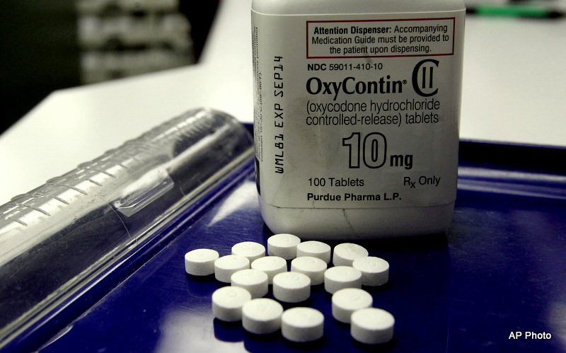 OxyContin pills are arranged for a photo at a pharmacy in Montpelier, Vt. on Tuesday, Feb. 19, 2013. 