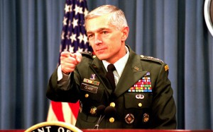 Wesley Clark, U.S. Army, takes questions from reporters during a briefing at the Pentagon on the status of the NATO-led, international peacekeeping operation in Bosnia and Herzegovina on Dec. 9, 1999. The first U.S. peacekeepers entered the war-ravaged country five years ago this month in an effort to stop the ethnic killings and prevent further deterioration of the region's infrastructure. DoD photo by R. D. Ward. (Released)