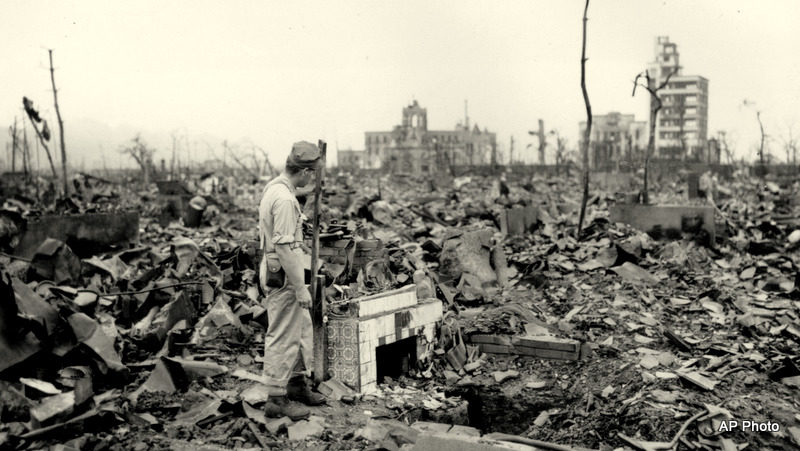 An unidentified man stands next to a tiled fireplace where a house once stood in Hiroshima, Japan, on Sept. 7, 1945. The vast ruin is a result of "Little Boy," the uranium atomic bomb detonated on Aug. 6 by the U.S.