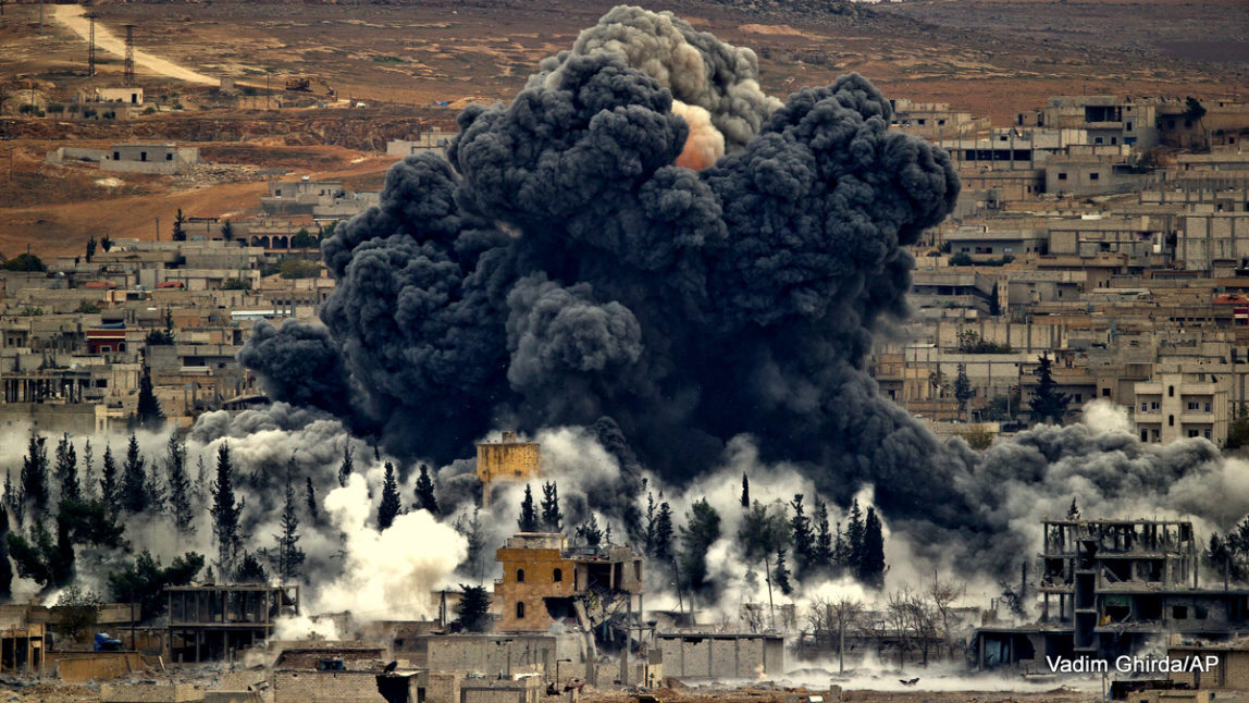 Smoke rises from the Syrian city of Kobani, following US airstrikes outside Suruc, on the Turkey-Syria border Monday, Nov. 17, 2014.