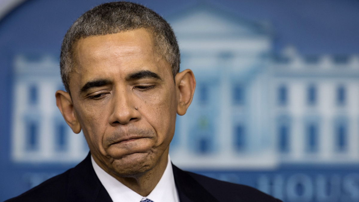 President Barack Obama pauses during a news conference in the Brady Press Briefing Room of the White House in Washington, Friday, Dec. 19, 2014. Photo credit: Carolyn Kaster/AP