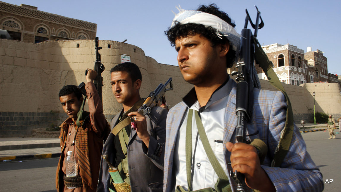 Shia rebels, known as Houthis, carry their weapons as they march to protest against Saudi-led airstrikes, during a rally in Sanaa, Yemen. (AP Photo/Hani Mohammed, File)