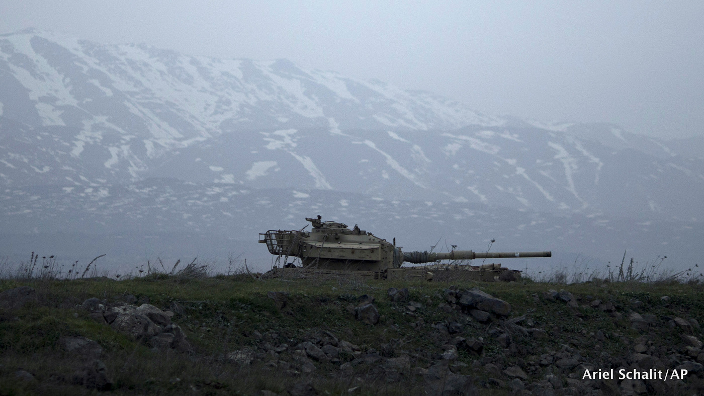 An old Israeli tank sits in a position in the Israeli-controlled Golan Heights near the border with Syria,Tuesday, Jan. 27, 2015.