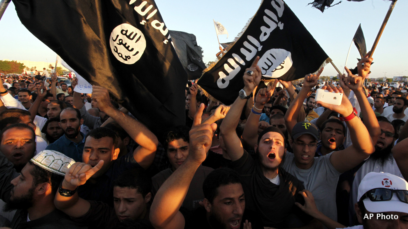 Libyan followers of Ansar al-Shariah Brigades display the ISIS flag during a protest, Friday, Sept. 21, 2012. (AP Photo)
