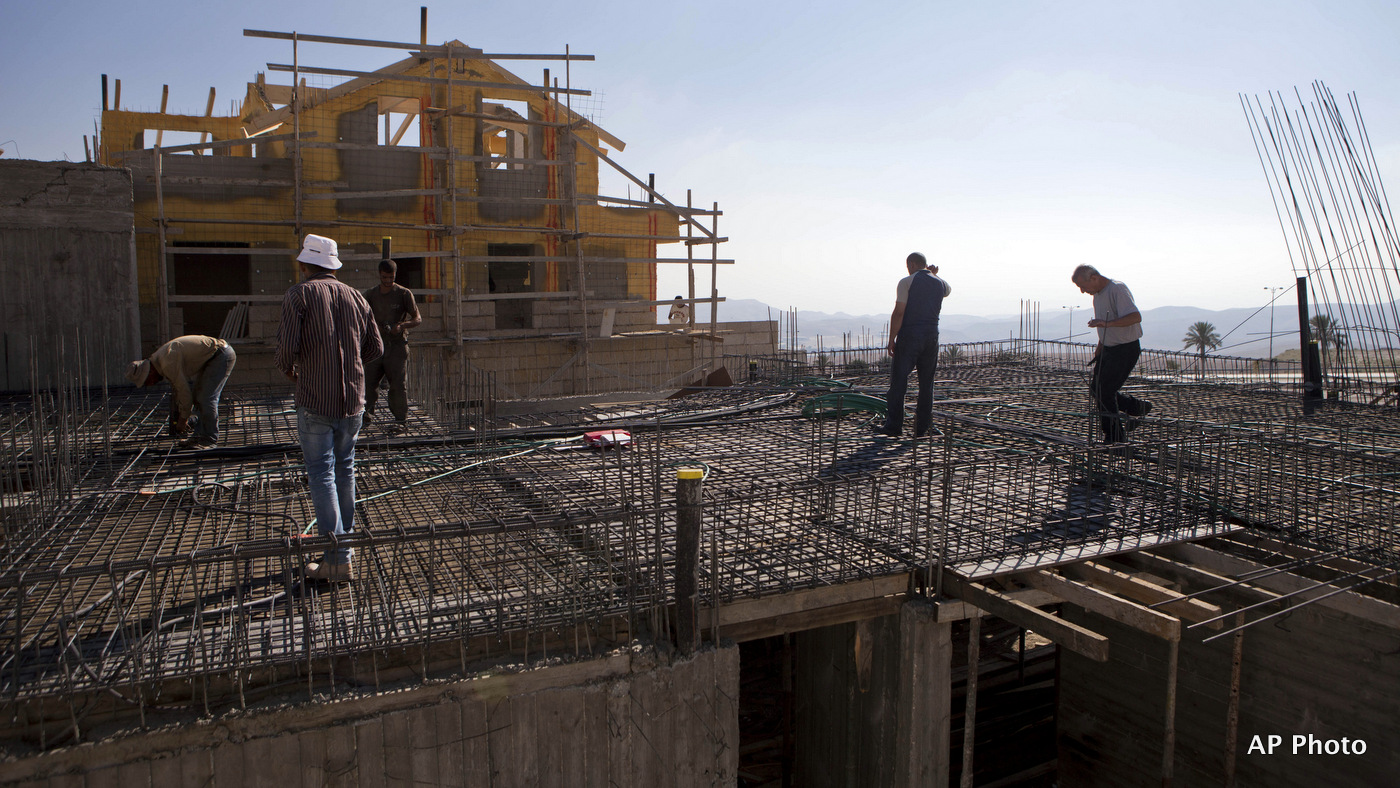 Palestinians laborers work at a construction site in the Jewish West Bank settlement of Maale Adumim, near Jerusalem.