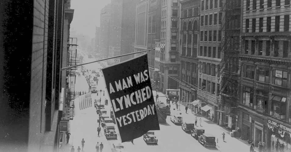 A flag announcing a lynching hangs from the window of the NAACP headquarters on 69 Fifth Ave., New York City. (Photo: Library of Congress)