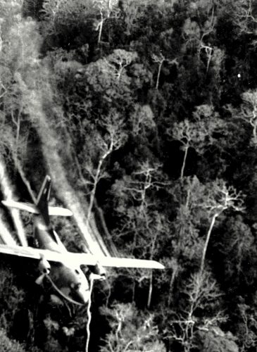 A U.S. Air Force C-123 flies low along a South Vietnamese highway spraying Agent Orange on dense jungle growth beside the road to eliminate ambush sites for the Viet Cong during the Vietnam War. During the Vietnam War, Air Force C-123 planes sprayed millions of gallons of herbicides over the jungles of Southeast Asia to destroy enemy crops and tree cover.