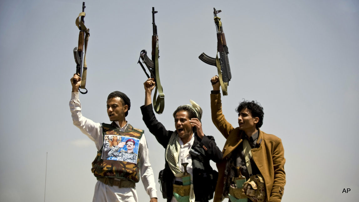 Supporters of Ahmed Ali Abdullah Saleh, the son of Yemeni former President Ali Abdullah Saleh, hold their weapons as they chant slogans during a demonstration demanding presidential elections be held and the younger Saleh run for the office, in Sanaa, Yemen, Tuesday, March 10, 2015. (AP Photo/Hani Mohammed)