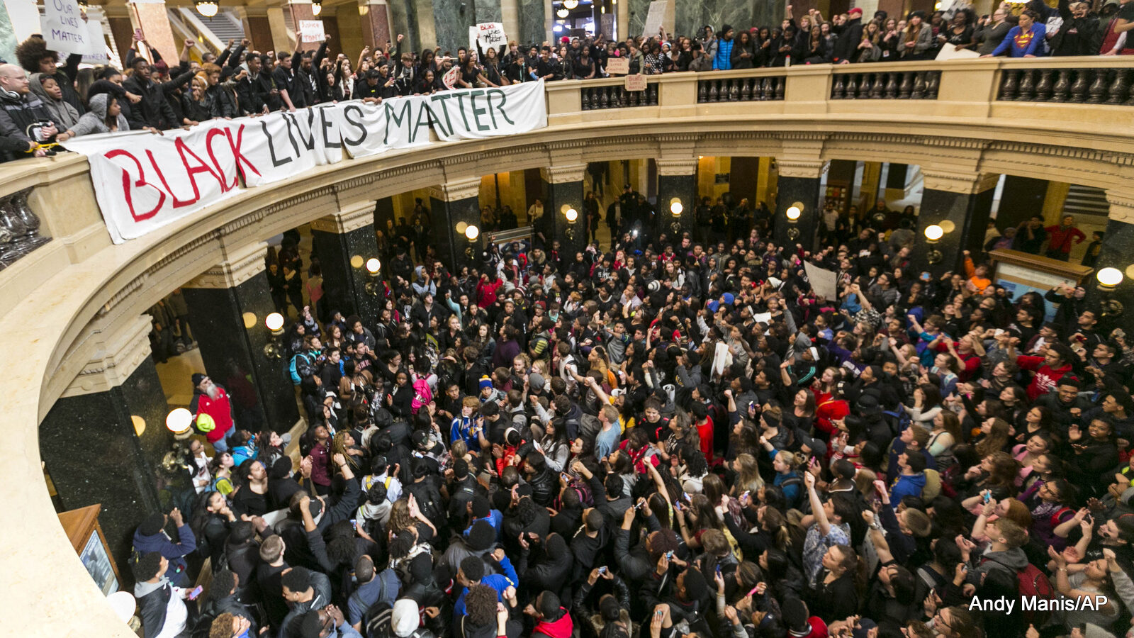 Demonstrators protest the shooting of Tony Robinson at the state Capitol Monday, March 9, 2015, in Madison, Wis. The officer who killed the unarmed black man was recently cleared of charges in the shooting.