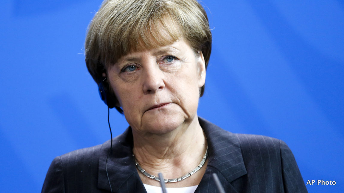 German Chancellor Angela Merkel attends a news conference with President of Mongolia Elbegdorj Tsakhia after a meeting at the chancellery in Berlin, Tuesday, March 3, 2015.