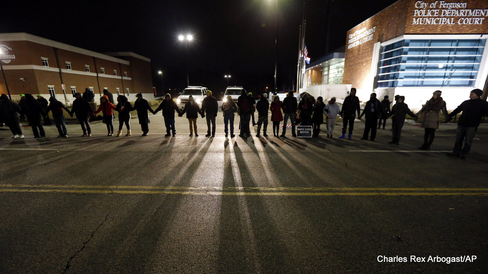 Protestors block traffic outside the Ferguson, Mo., police department, Wednesday, March 4, 2015, in Ferguson.