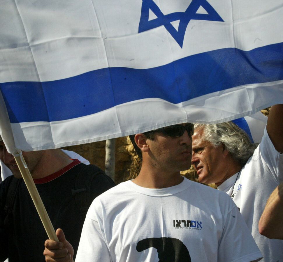 An Israeli, wearing a shirt with an image of Theodor Herzl, the founder of modern Zionism