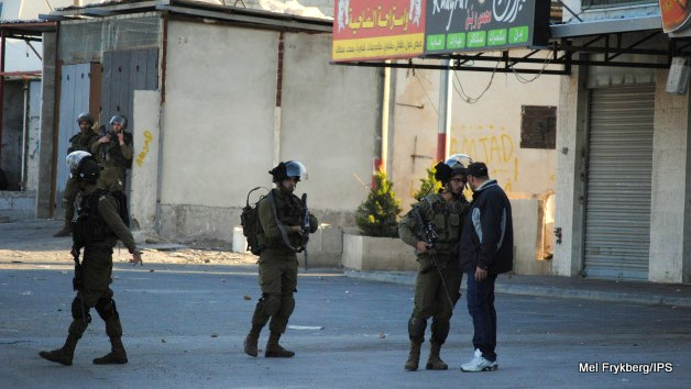 Unarmed Palestinian confronts Israeli soldiers