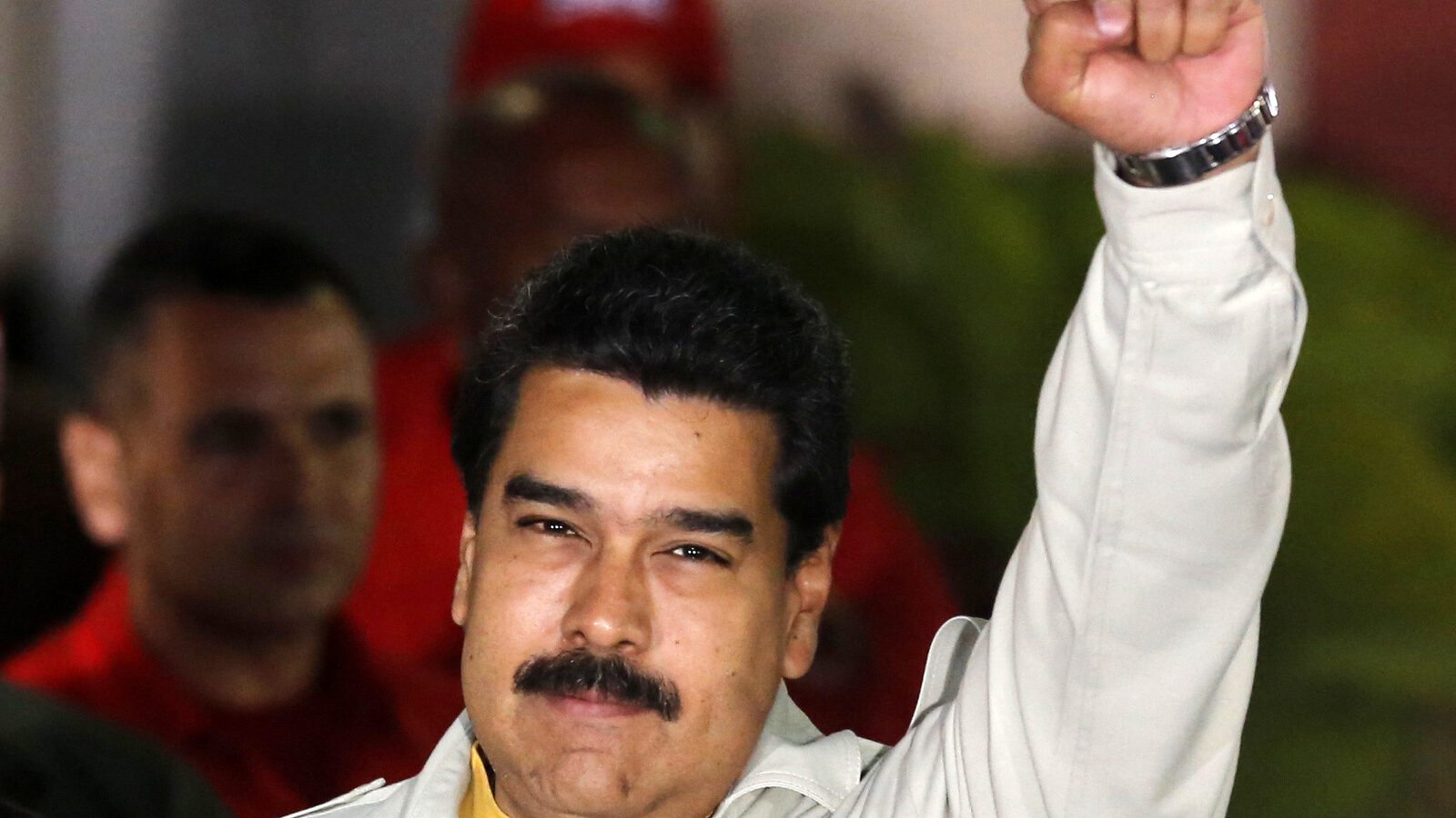 Venezuela's President Nicolas Maduro holds up a clenched fist as he greets supporters during an event at Miraflores presidential palace in Caracas, Venezuela. In a fiery speech late Monday, March 9, 2015.