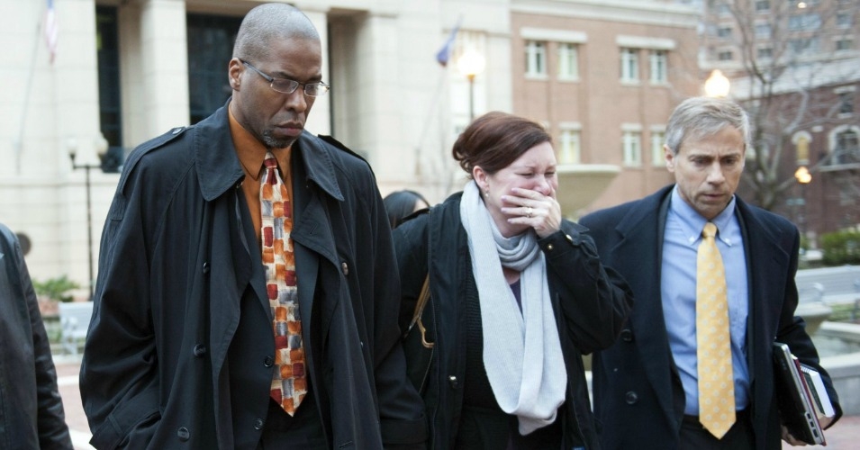 Former CIA officer Jeffrey Sterling, left, leaves the Alexandria Federal Courthouse on Jan. 26 with his wife Holly, center, and attorney Barry Pollack, after being convicted on all nine counts he faced of leaking classified information to a reporter. Photo: Kevin Wolf/AP