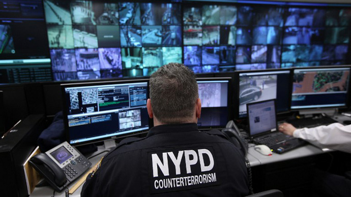 NEW YORK, NY - APRIL 23: Police and private security personel monitor security cameras at the Lower Manhattan Security Initiative on April 23, 2013 in New York City. At the counter-terrorism center, police and private security personel monitor more than 4,000 surveillance cameras and license plate readers mounted around the Financial District and surrounding parts of Lower Manhattan. Designed to identify potential threats it is modeled after London's "Ring of Steel" system.