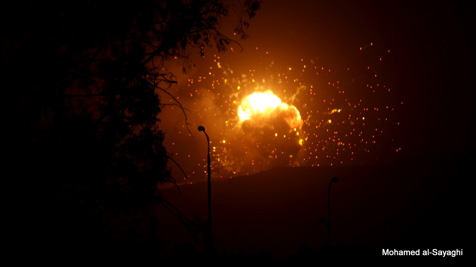 Fire is seen at a military site after it was hit by an air strike on the Faj Attan mountain of Sanaa March 30, 2015.