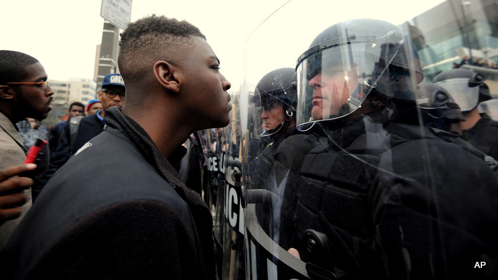 Police and protestors line up against each other across from Camden Yards as protests continue in the wake of Freddie Gray's death while in police custody. (Credit Image: © Algerina Perna/TNS/ZUMA Wire)