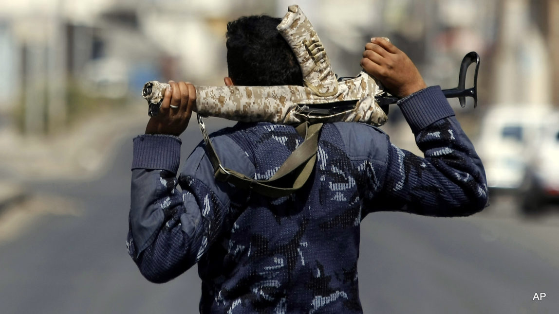 A man stands guard in a street in Sanaa, Yemen, after an al-Qaida attack. Al-Qaida has spread to operate in every province of the country of more than 25 million.