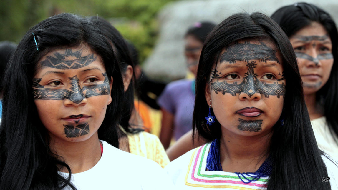 Sarayaku women attend a ceremony where the Ecuadorian Government offered a public apology that came as part of a ruling by the Inter-American Human Rights Court which found that the government allowed for oil exploration in Sarayaku lands without their consent. Indigenous people will have access to the courts as part of a recent historical declaration protecting the rights of Indigenous peoples through-out the Americas, with the exception of the U.S. and Canada.