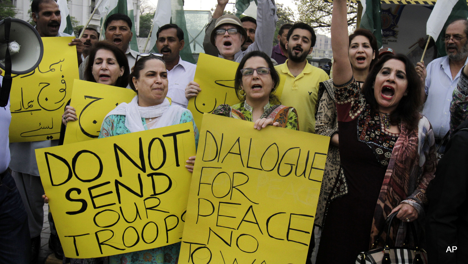 Members of Pakistan's civil society chant slogans against the Saudi-led coalition targeting Shiite rebels in Yemen, during a demonstration, in Lahore, Pakistan, Monday, April 6, 2015. A Saudi-led coalition targeting Shiite rebels in Yemen has asked Pakistan to contribute soldiers, Pakistan's defense minister said Monday, raising the possibility of a ground offensive in the country.