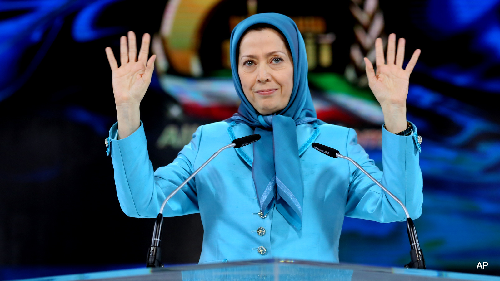 Maryam Rajavi, the leader of the National Council of Resistance of Iran, waves to the audience as she addresses thousands of exiled Iranians in Villepinte, north of Paris, Friday June 27, 2014.