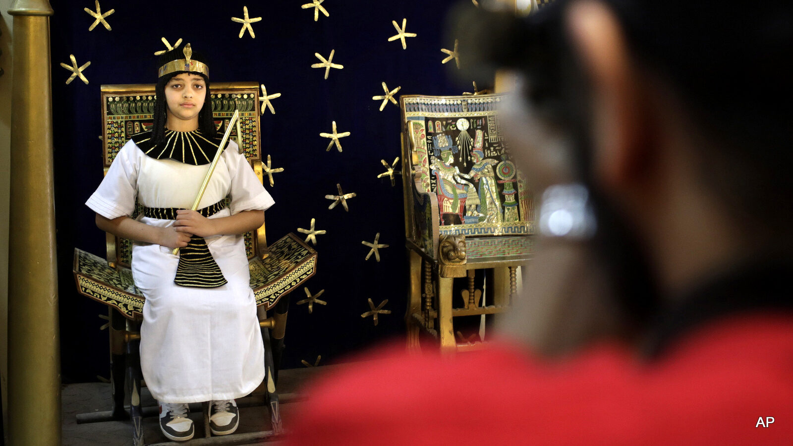 Nour Mahmoud, 12, wearing a Pharaonic costume poses for a photograph at the studio of the Pharaonic Village, during Sham el-Nessim, or “smelling the breeze,” in Giza, Egypt, Monday, April 13, 2015. The holiday signifies the arrival of Spring, a uniquely Egyptian tradition practiced since the days of the Pharaohs.
