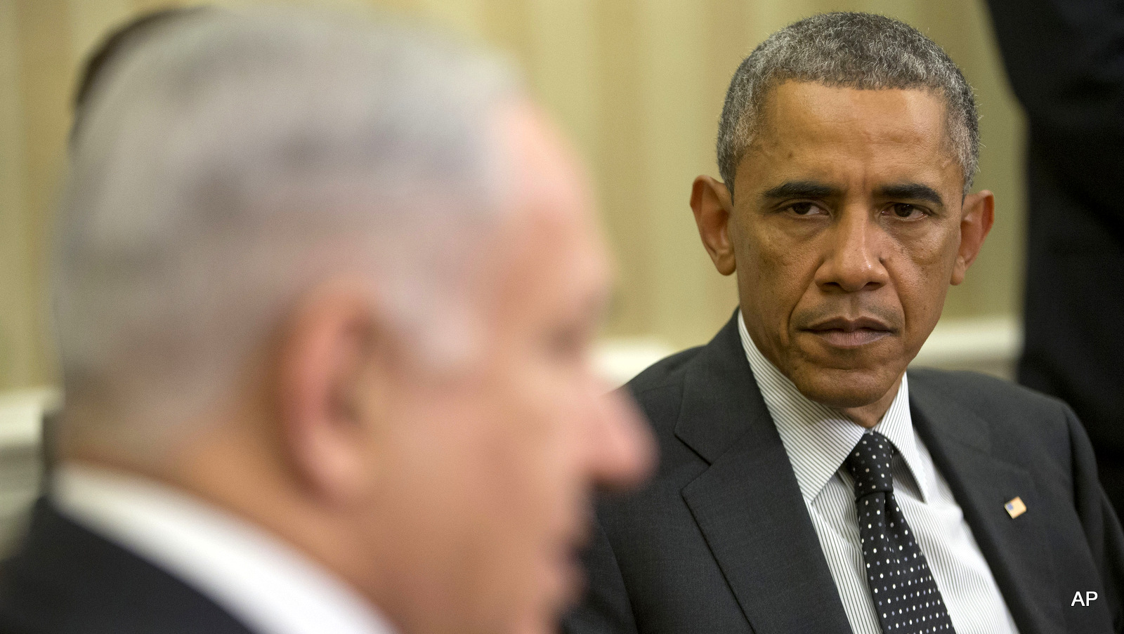President Barack Obama listens as Israeli Prime Minister Benjamin Netanyahu speaks during their meeting in the Oval Office of the White House in Washington, Wednesday, Oct. 1, 2014.