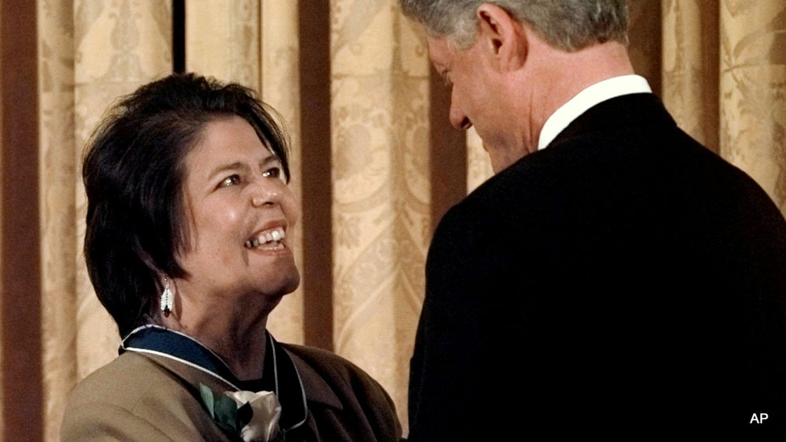 President Bill Clinton hugs former Cherokee Nation chief Wilma Mankiller after presenting her with a Presidential Medal of Freedom during a ceremony at the White House, Jan. 15, 1998 .