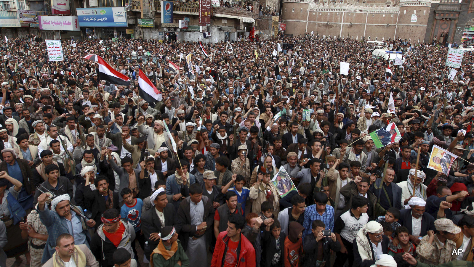 Yemenis gather to protest against Saudi-led airstrikes, during a rally in Sanaa, Yemen, Thursday, March 26, 2015.
