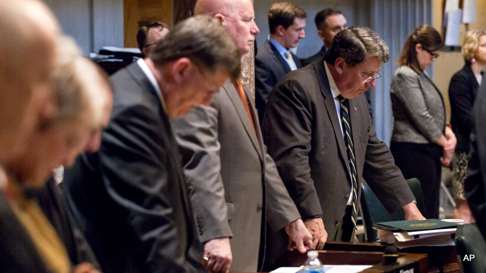 State Senate Majority Leader Mark Norris, R-, right, and other senators bow their heads during the prayer before the Senate floor session in Nashville, Tenn., April 16, 2015. (AP/Erik Schelzig)