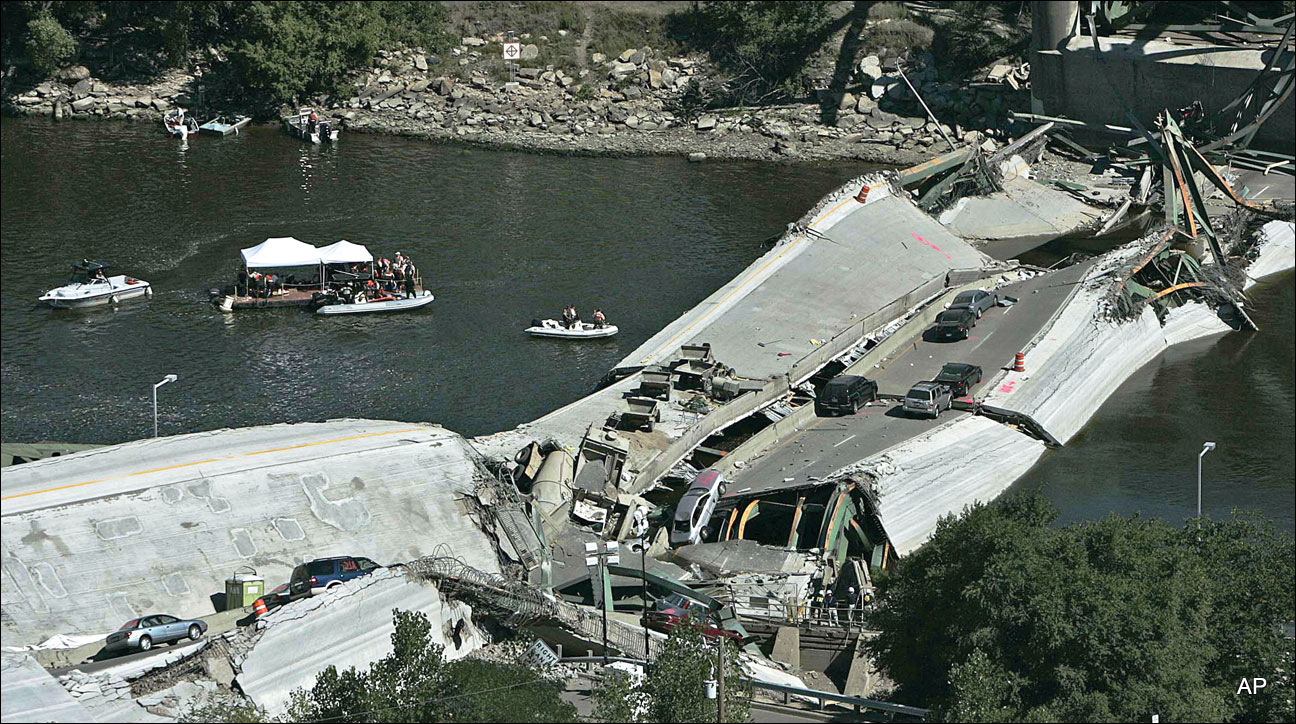 Divers search the Mississippi River on Aug. 3, 2007, during recovery efforts after the Interstate 35W bridge collapsed in Minneapolis.